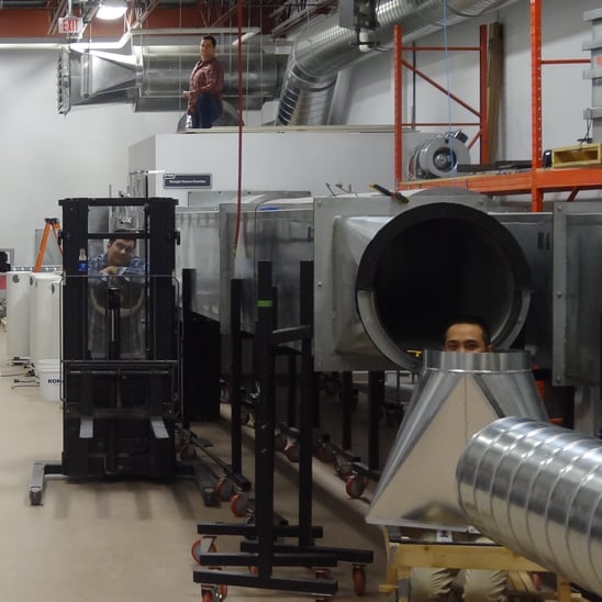 Three members of the Price team hiding behind equipment in PRCN