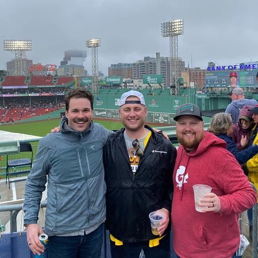 Cody and customers at a baseball game