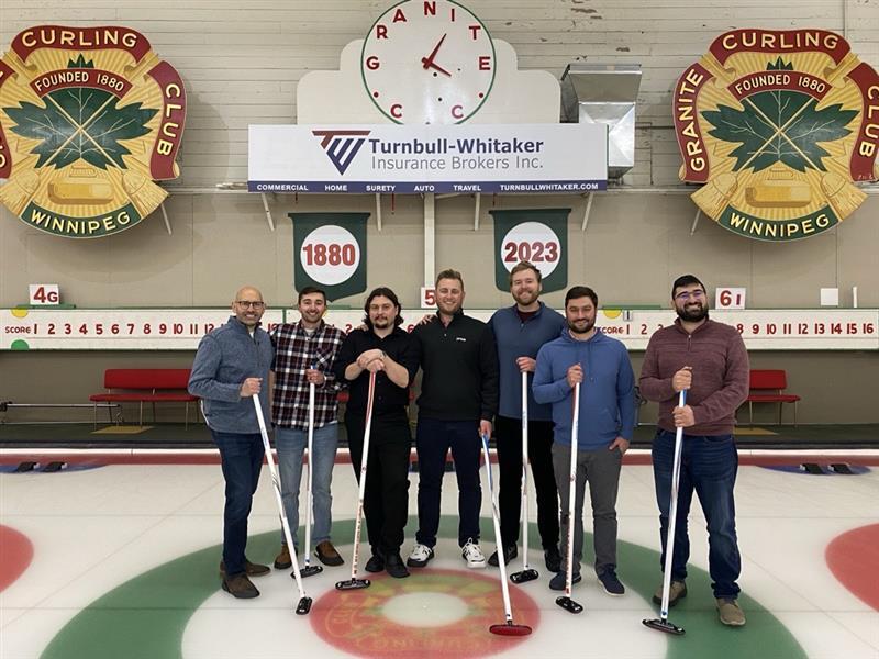 Cody with Price team members and customers at a curling rink