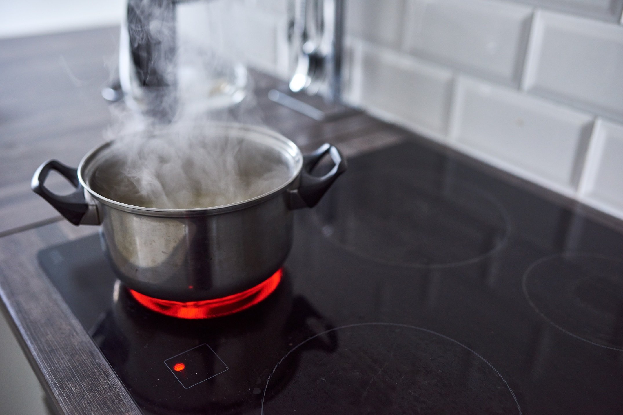 Pot of boiling water on stove top