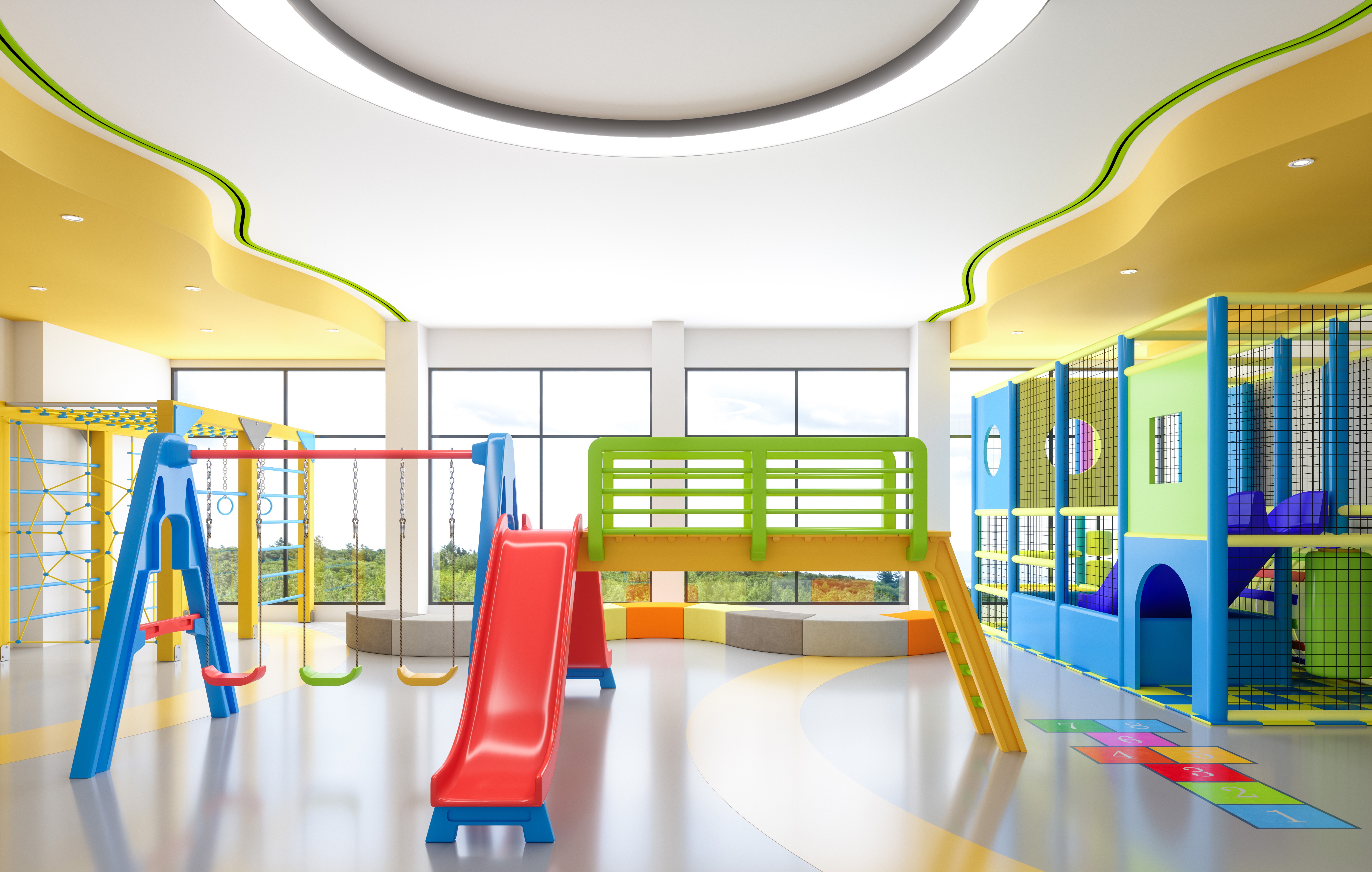 Indoor playground with a bright green slot diffuser installed in the ceiling