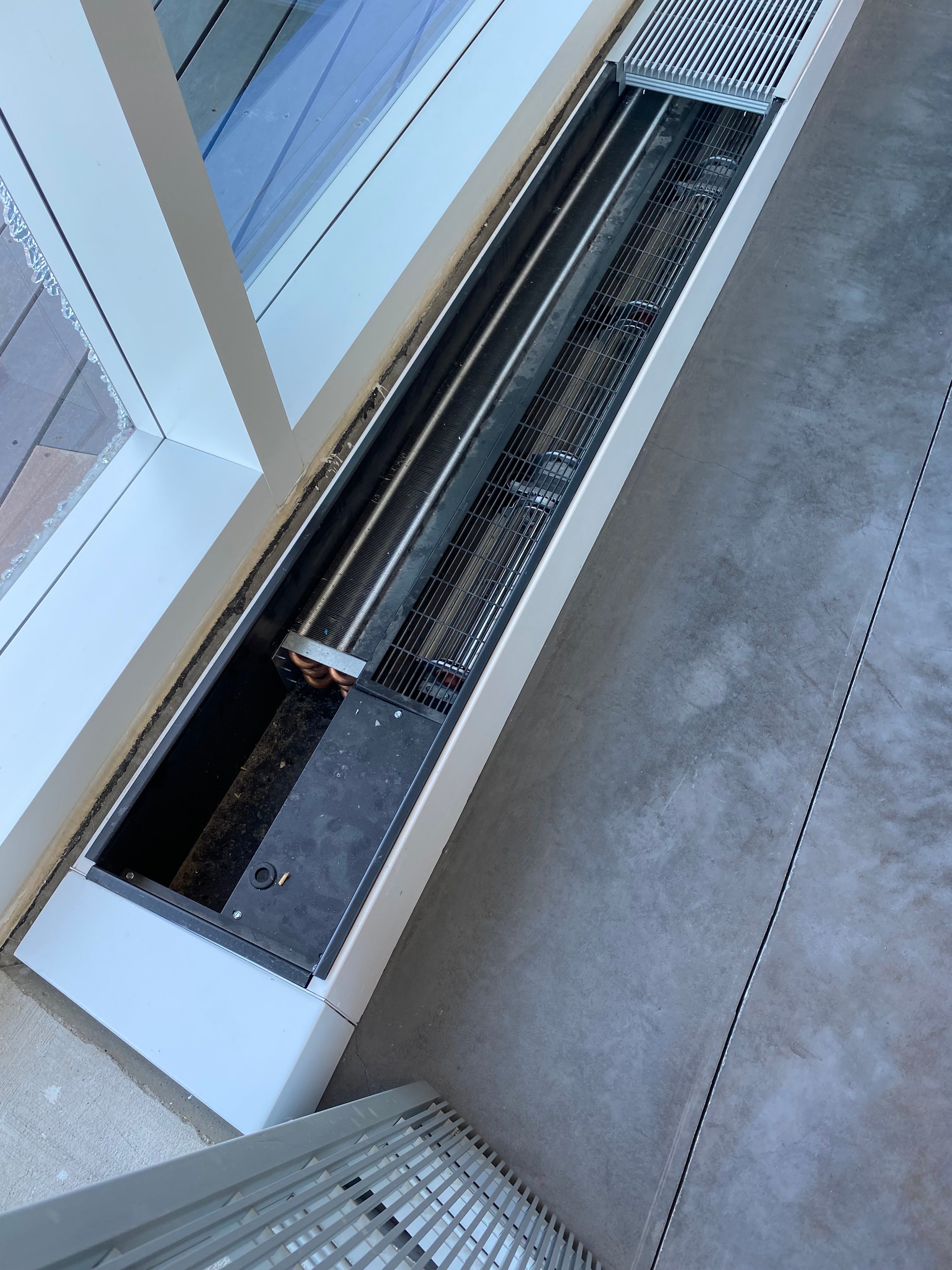 Fan trench heater mounted in a low-profile enclosure