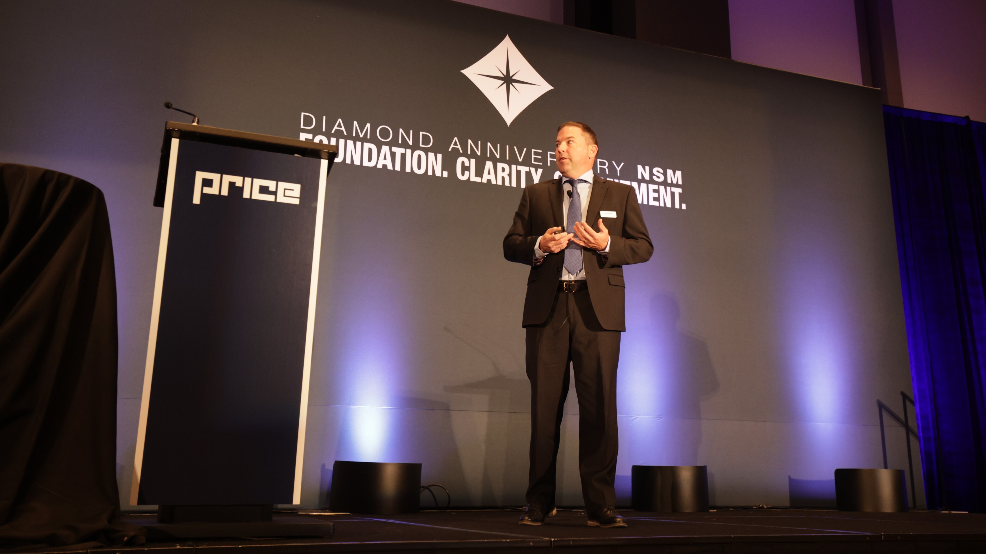 JP speaking on stage at NSM in 2023
