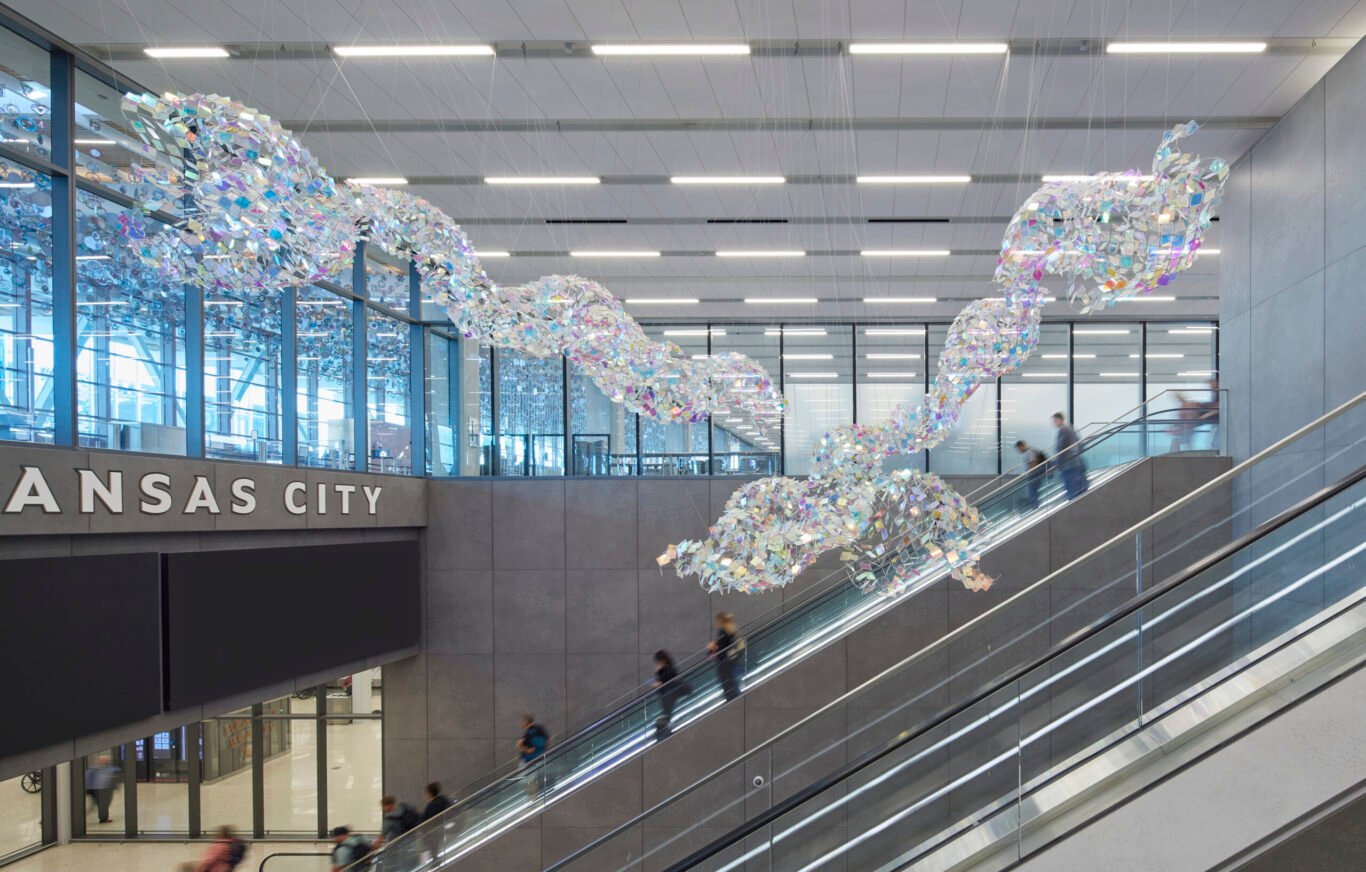 Air travelers on escalator