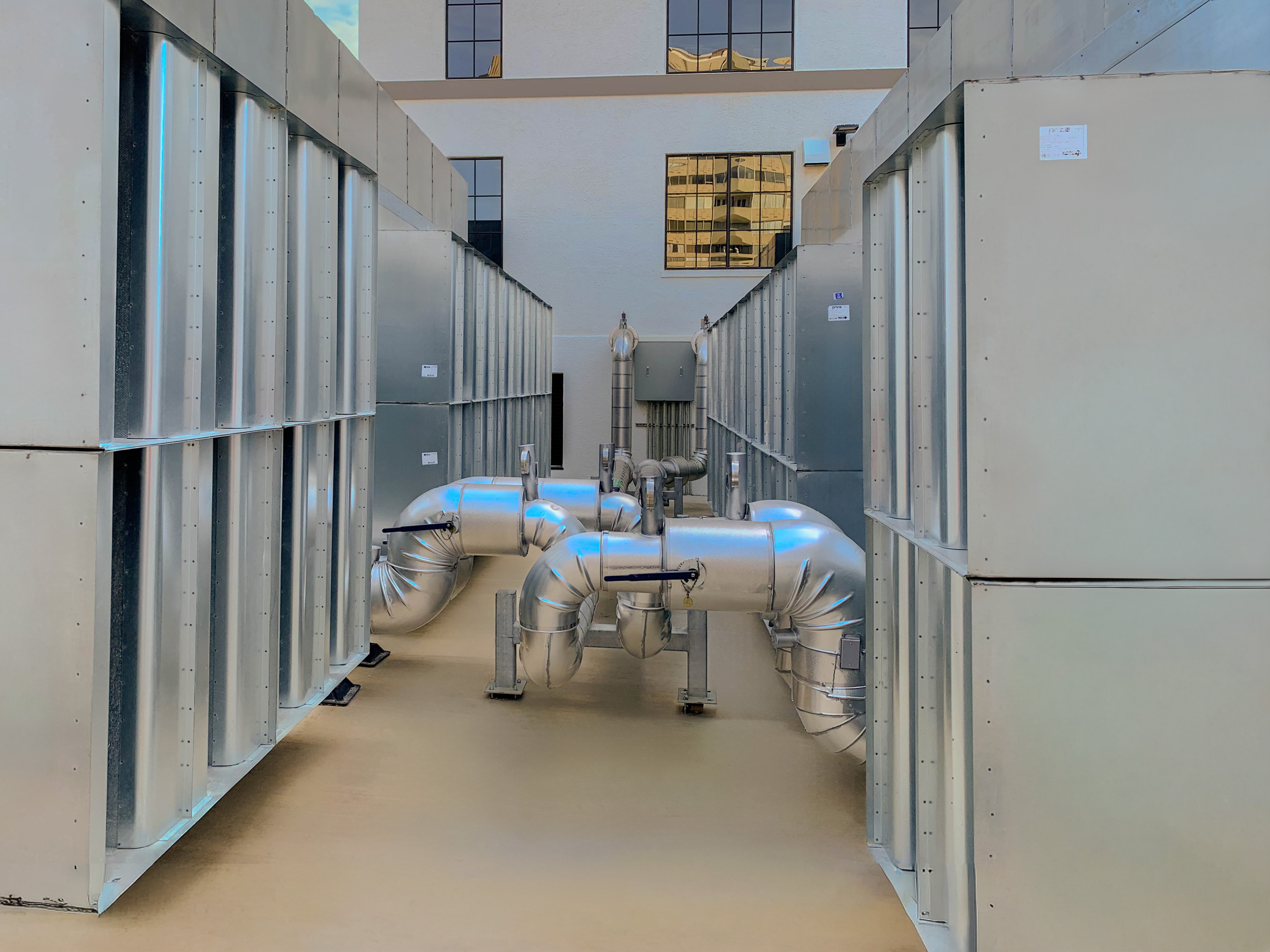 A Price Acoustic Panel chiller enclosure with intake and discharge silencer banks