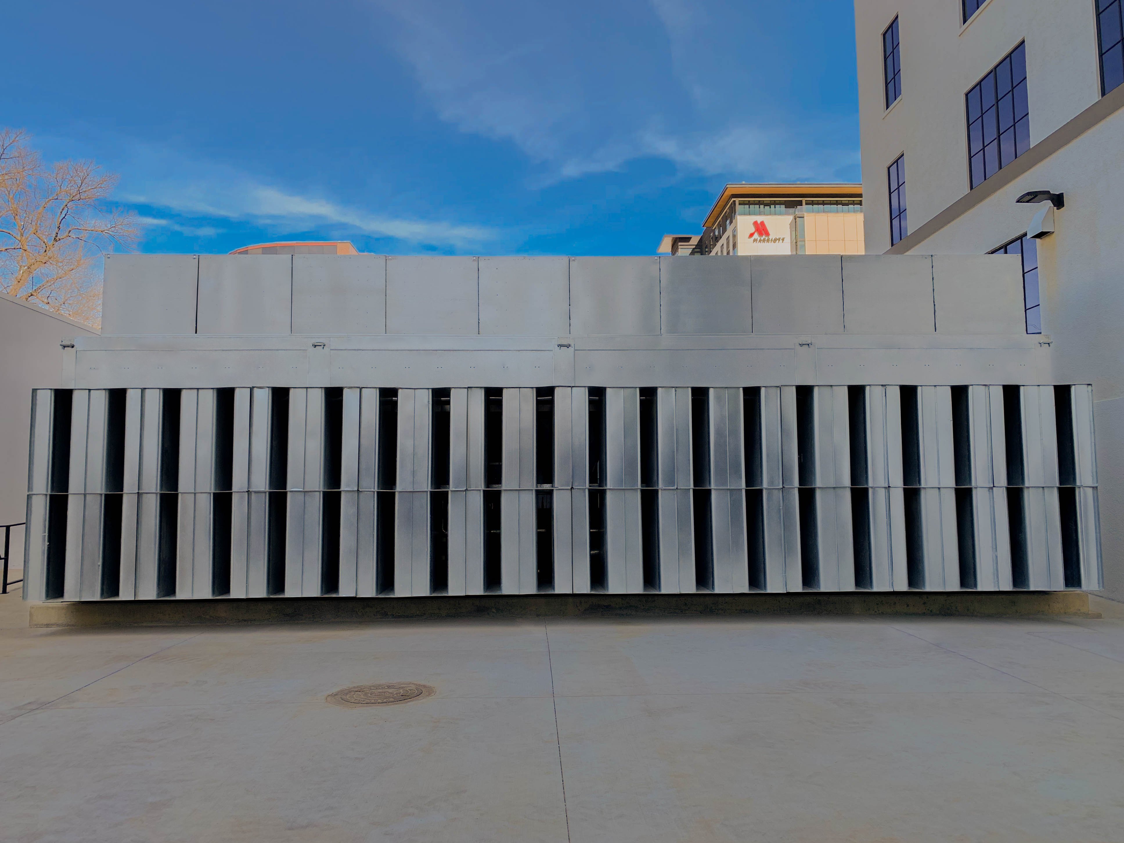 A Price Acoustic Panel chiller enclosure with intake and discharge silencer banks