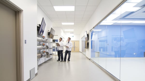 Michael and Dale Paskaruk standing in the lab