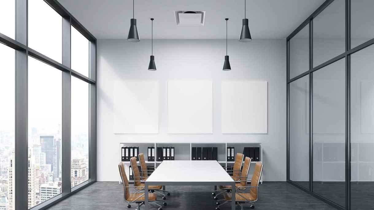 A VAV diffuser installed in the ceiling of an office boardroom
