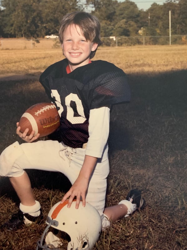 Young Jeff Rogers on the football field