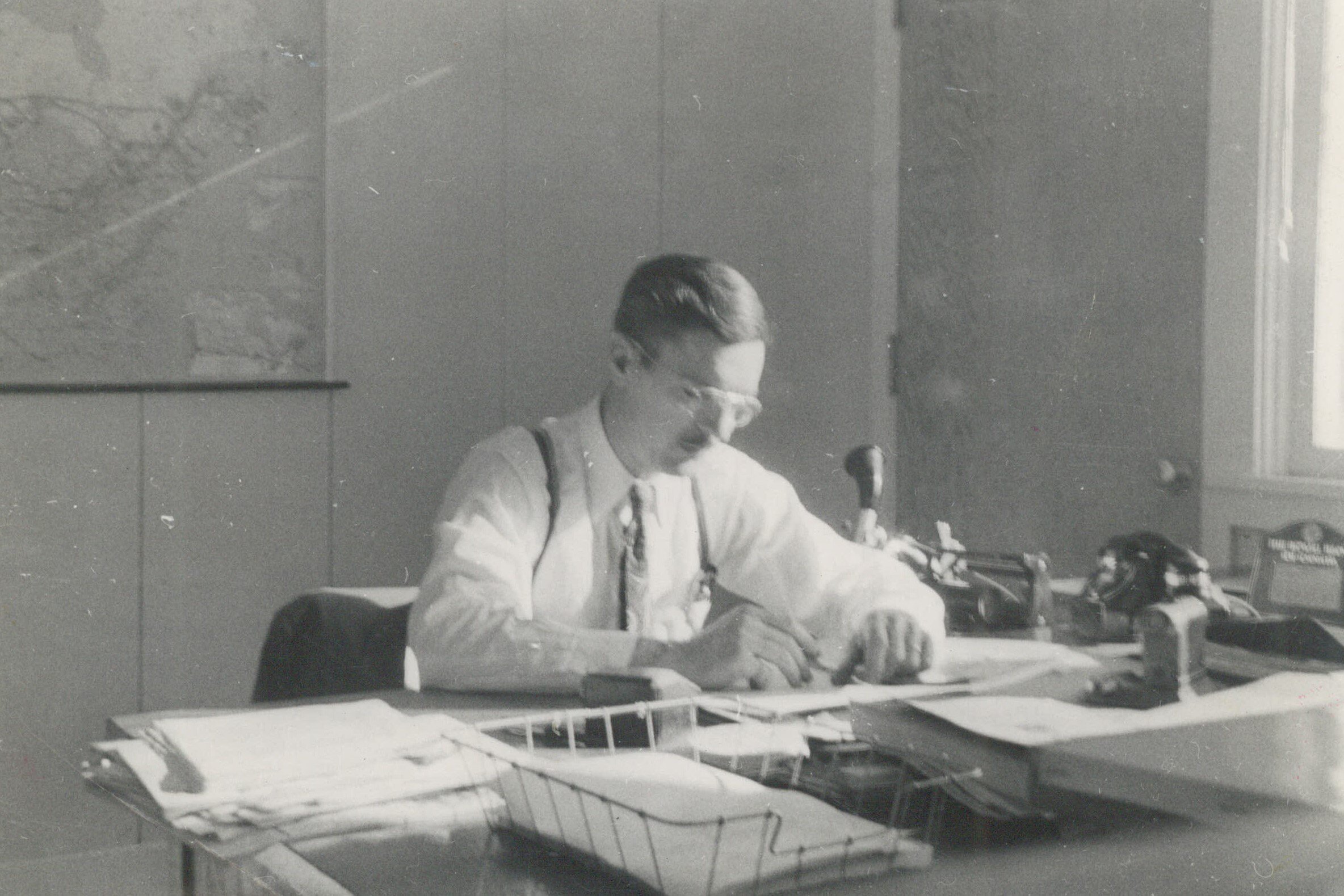 Ernie Price working at his desk